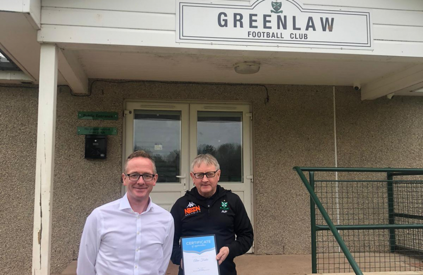 John Lamont MP with volunteer award winner 